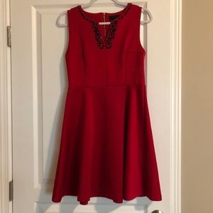 Cynthia Rowley red dress w/ black embellishments.